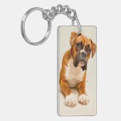 アイボリーのクリーム色の背景幕のボクサーの子犬 キーホルダー (正面左)