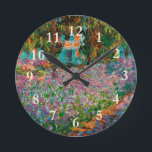 アイリスモネガーデンギヴェルニー花 ラウンド壁時計<br><div class="desc">モネ絵を描の最高傑作 – モネの庭のアイリスと呼ばれるカラフルの花ジヴェルニーで絵を描は、クロード・モネによって1900絵を描年に生まれた。</div>