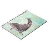 アクアグリーンのまわりにウォーターにイルカがはね込む ノートブック (左側)