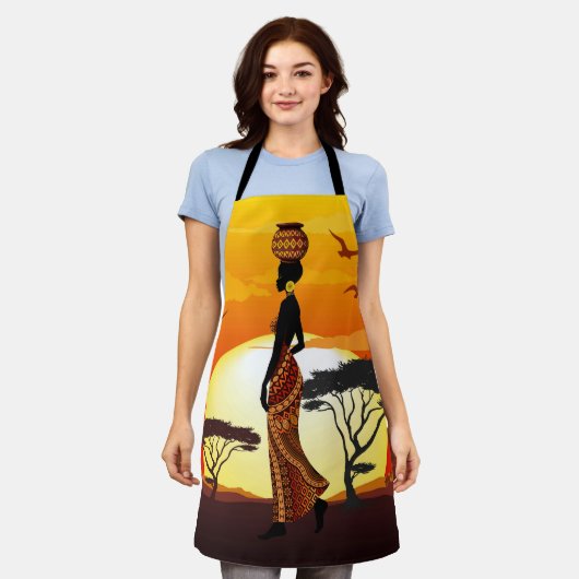 アフリカの太陽に輝くアフリカの美しい女性のシルエット エプロン (着用した状態)