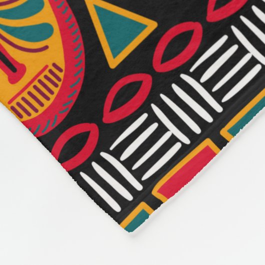 アフリカの黒い背景に装飾的な模様 フリースブランケット (角)