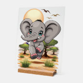 アフリカンサバンナで象のベビーが幸せにジャンプ アクリルサイン (傾斜)