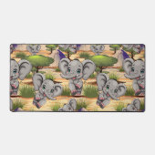 アフリカンサバンナで象のベビーが幸せにジャンプ デスクマット (正面)