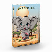 アフリカンサバンナで象のベビーが幸せにジャンプ フォトブロック (左)