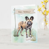 アフリカ産の野生の犬が誕生日の標識の下で繁殖 カード (黄色い花)