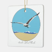 アメリア島，フロリダシーガル飛んでいるオーバービーチ セラミックオーナメント (左)