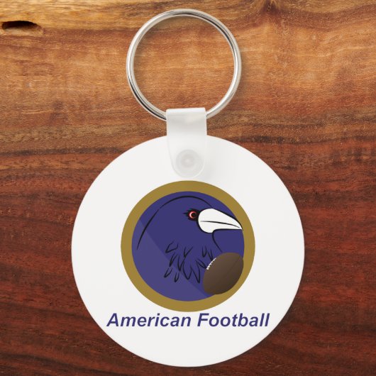 アメリカンフットボールのボールを持つレイブン キーホルダー (正面)