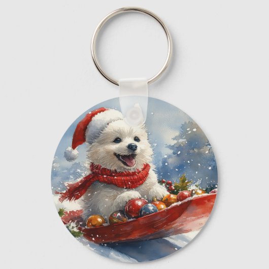 アメリカン・エスキモー犬がそりで雪遊び クリスマスの雪が降るよ キーホルダー (正面)