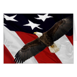 アメリカ国旗の上を飛んでいるワシ