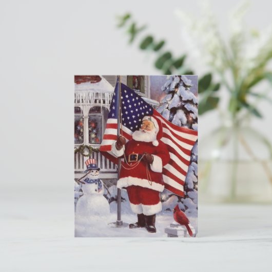 アメリカ国旗を掲げた愛国的なクリスマスサンタホールディングス シーズンポストカード (スタンド正面)
