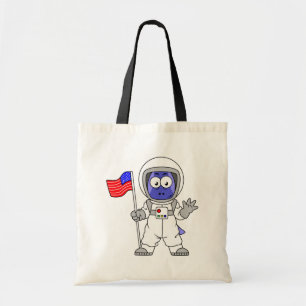 アメリカ国旗を掲げている宇宙飛行士。 トートバッグ