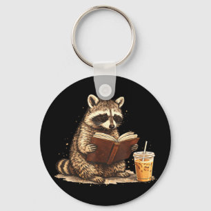 アライグマがアイスコーヒーを飲みながら本を読む キーホルダー