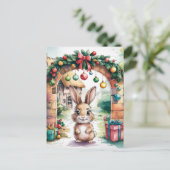 アーチの下にかわいい茶色のクリスマスバニー ポストカード (スタンド正面)