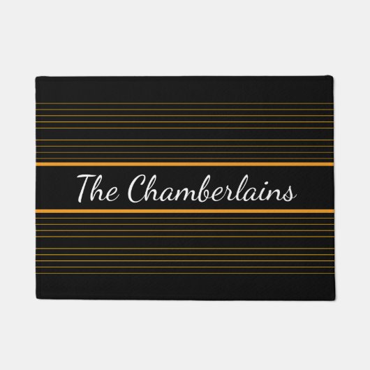 イエローオレンジゴールデントレブルクレフ、 音符記号ストーブオンブラック ドアマット (正面)