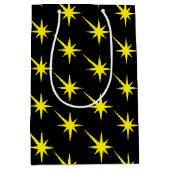イエロースターズ、雪片ブラックパターンギフト ミディアムペーパーバッグ (正面)