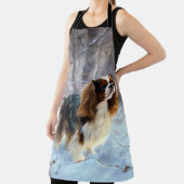 イギリスのおもちゃスパニエル犬が雪のクリスマスを過ごす エプロン (インサイチュ)