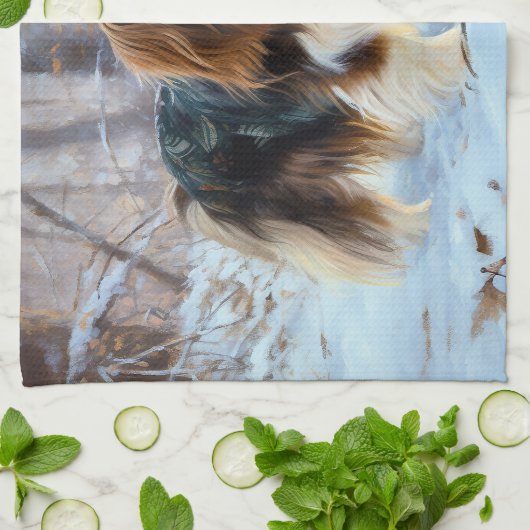 イギリスのおもちゃスパニエル犬が雪のクリスマスを過ごす キッチンタオル (折り畳み)