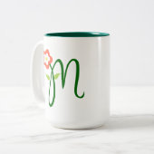 イニシャルレターグリーンモノグラム、オレンジフラワー ツートーンマグカップ (正面左)