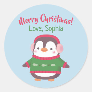 イヤーマフとクリスマスセーターを着たかわいいペンギン ラウンドシール