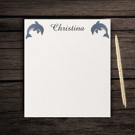 イルカがダークブルーを飛び跳ねるかわいい2匹の輝き ノートパッド