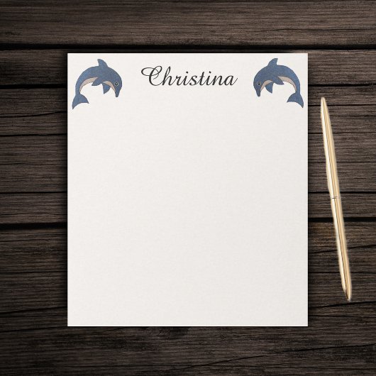 イルカがダークブルーを飛び跳ねるかわいい2匹の輝き ノートパッド