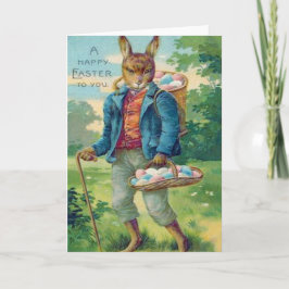 イースターのウサギのバスケットによって着色される卵 シーズンカード