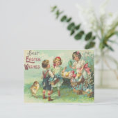 イースターエッグのイースターカードを持つヴィンテージの子供 シーズンポストカード (スタンド正面)