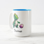 イースターエッグを持つかわいい緑の恐竜 ツートーンマグカップ (正面左)