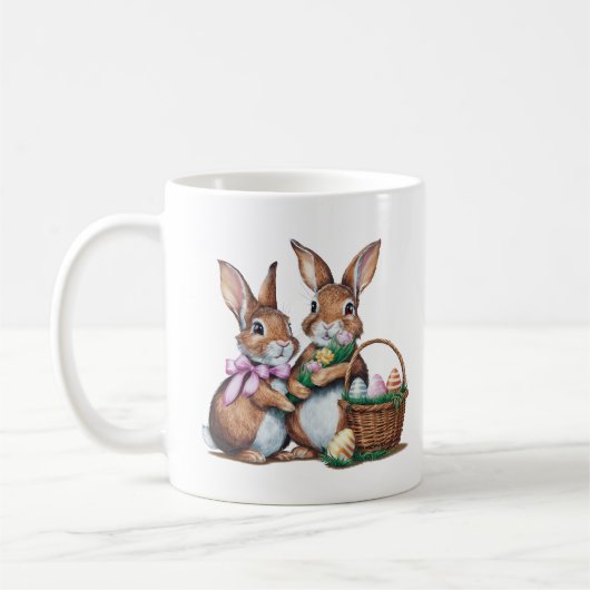 イースターバニーのウサギ2頭とバスケットと卵 コーヒーマグカップ (左)