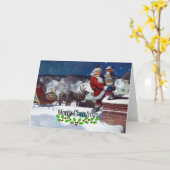 ウィーエスのサンタが本の束を届ける カード (黄色い花)