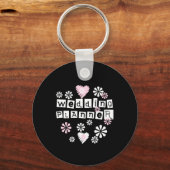 ウェディングプランナーの花が白い上に黒 キーホルダー (正面)