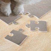 ウェルシュ・ペンブロークコルギ犬が木の床に横たわっている。 ジグソーパズル (側面)