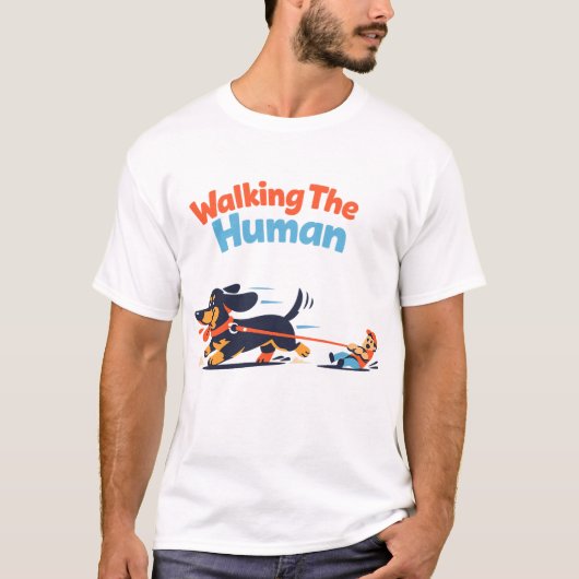 ウォーキング・ザ・ヒューマン 面白い犬の飼い主 カートゥーン デザイン Tシャツ (正面)
