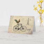 エッフェル塔によってバイクに乗っているヴィンテージのオンドリ カード (黄色い花)