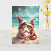 エルフの子供たちビーチで – クリスマス 砂のお城 カード (黄色い花)
