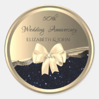 エレガントなゴールドの弓とブラックグリッターの周年記念