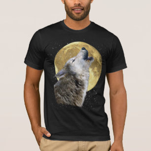 オオカミ雪の月でハウリング冬の野生動物ティー Tシャツ