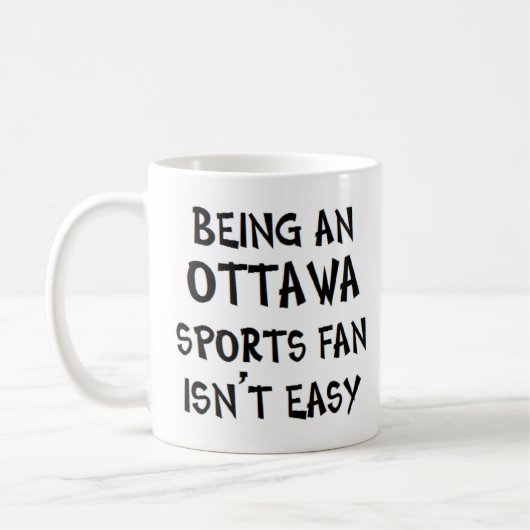オタワスポーツファンであること コーヒーマグカップ (左)