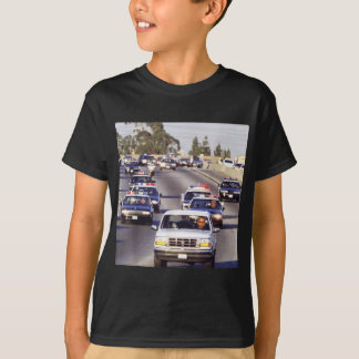 オバマを追いかける警官の車のトランプとJd Vance Tシャツ