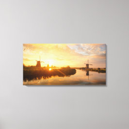 オランダの風車と川の上の日の出 キャンバスプリント