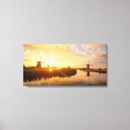 オランダの風車と川の上の日の出 キャンバスプリント (正面)