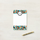 オレンジおよび水のクールな未来派の円 ポストイット (デスク上)