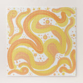 オレンジと黄色の渦巻き形にドットが付いている ジグソーパズル (縦)