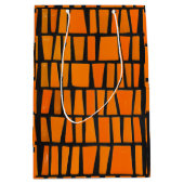 オレンジと黒のアフリカの部族パターン ミディアムペーパーバッグ (正面)