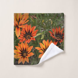 オレンジと黒ガザニア顔タオル ウォッシュタオル