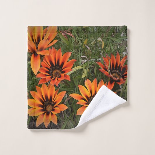 オレンジと黒ガザニア顔タオル ウォッシュタオル (ウォッシュタオル)