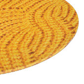 オレンジのニットのセーター、テクスチャ付きの背景。 カッティングボード (角)