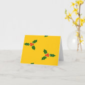 オレンジの背景にクリスマスのホーリー カード (黄色い花)