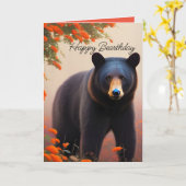 オレンジの花の中の黒いクマ カード (黄色い花)