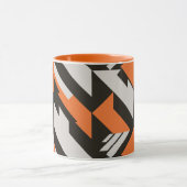 オレンジはっきりした色と黒の幾何学的デザイン マグカップ (中央)